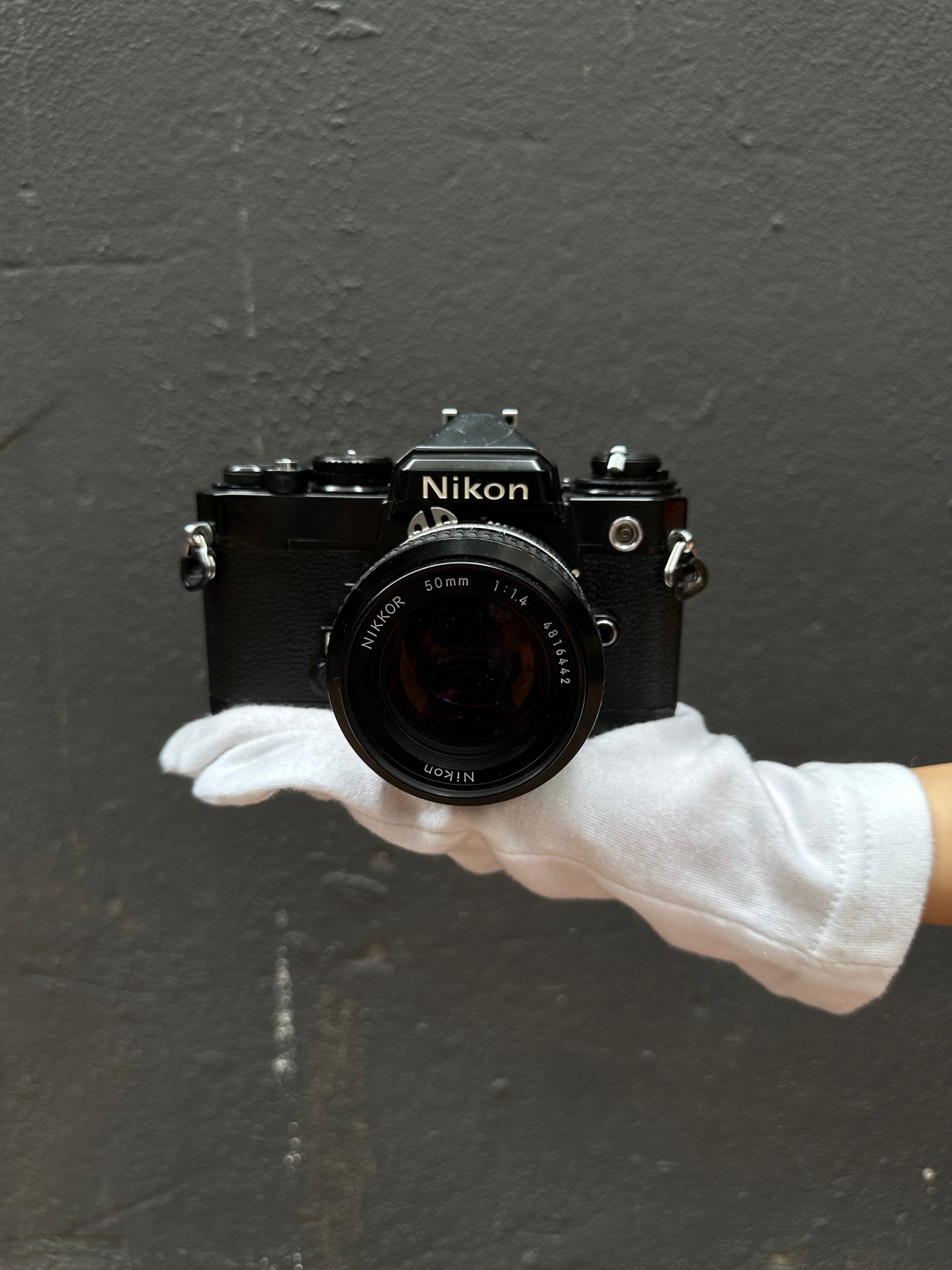 nikon-fe-spiegelreflexkamera-mit-nikkor-50mm-f-1-4 image 1