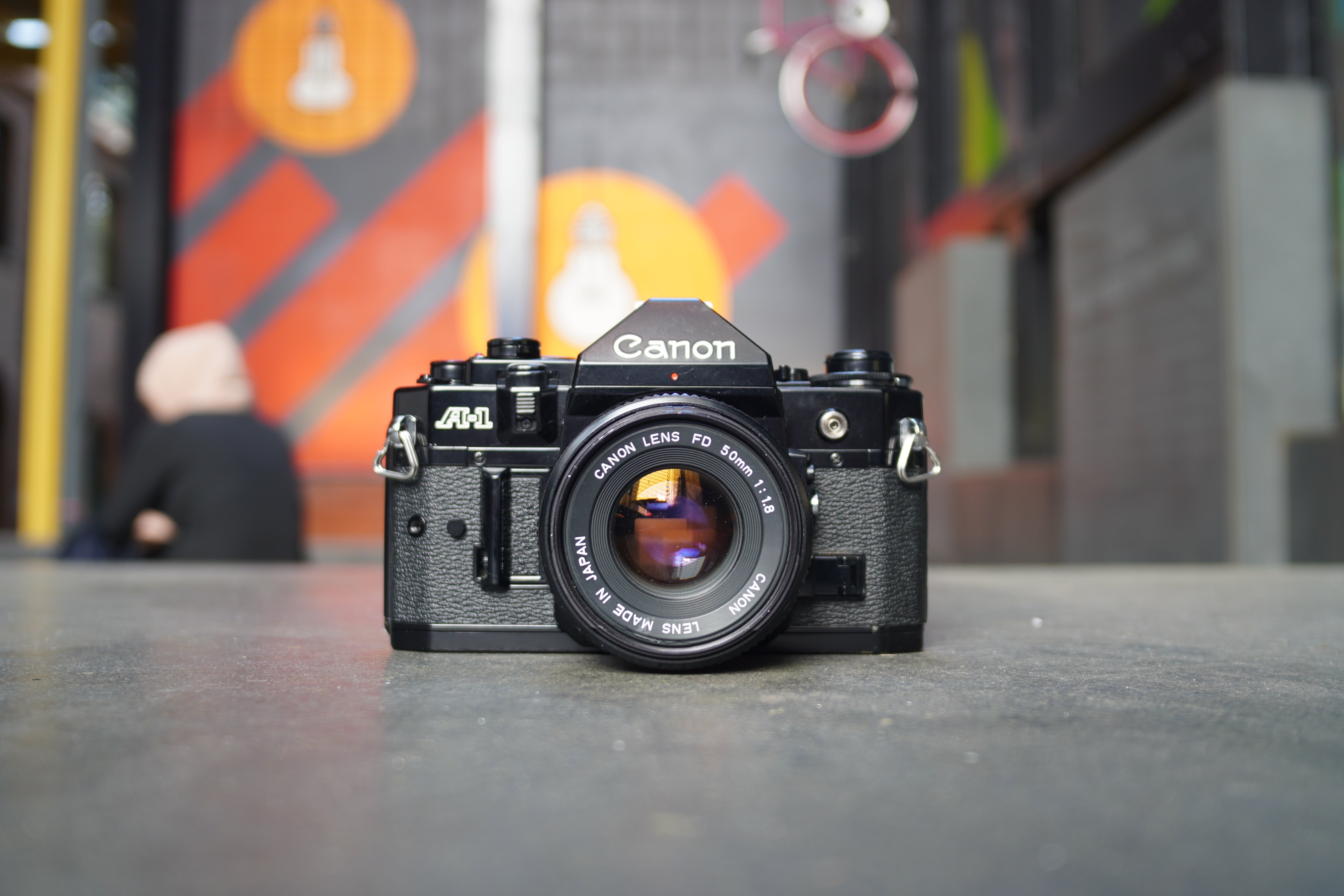 canon-a-1-slr-analogkamera-mit-fd-50mm-f-1-8-objektiv image 1