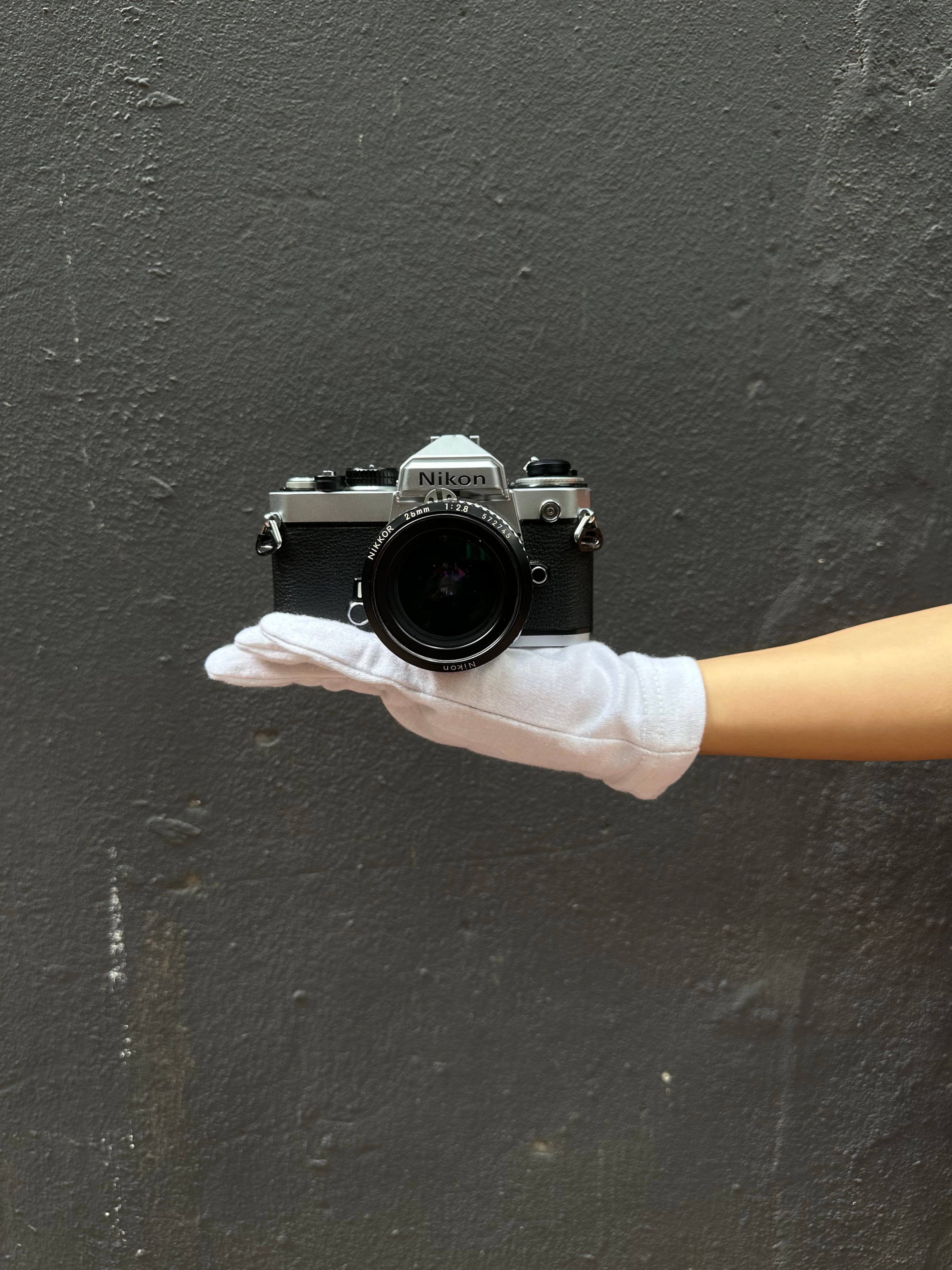 nikon-fe-spiegelreflexkamera-mit-nikkor-28mm-f-2-8 image 1
